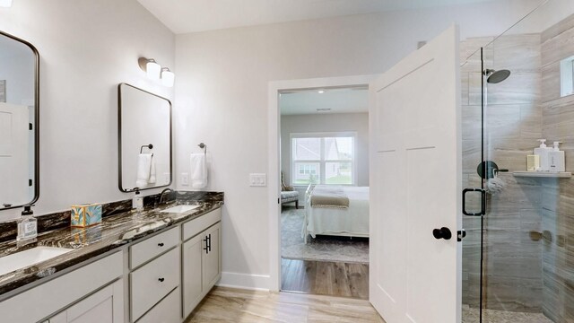 1137 Fiona Dr, Lebanon, TN 37087 - bathroom with a shower stall, double vanity, ensuite bathroom, baseboards, and wood finished floors
