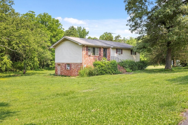 169 Wawona Dr, Wildwood, GA 30757 - view of front of house with brick siding and a front yard
