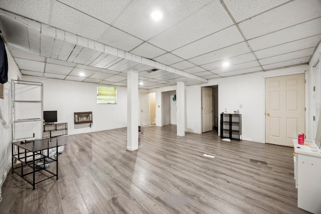 169 Wawona Dr, Wildwood, GA 30757 - finished basement featuring wood finished floors, a drop ceiling, heating unit, and baseboards