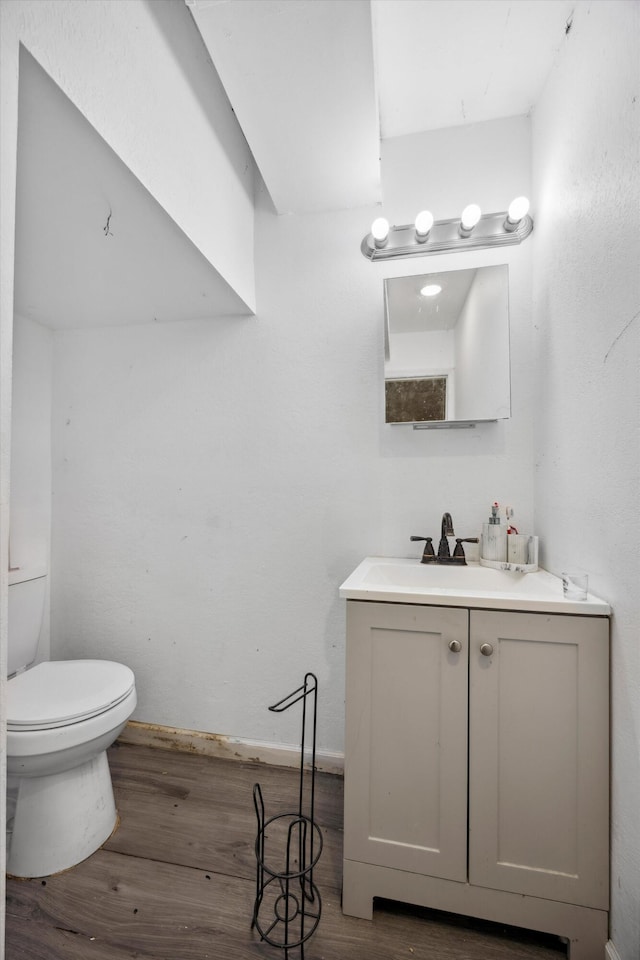 169 Wawona Dr, Wildwood, GA 30757 - bathroom with wood finished floors, toilet, vanity, and baseboards