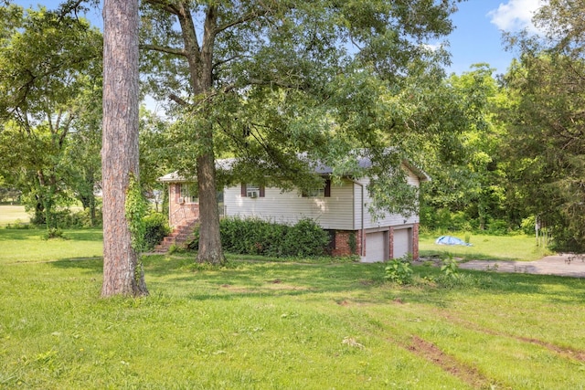 169 Wawona Dr, Wildwood, GA 30757 - view of grassy yard with a garage