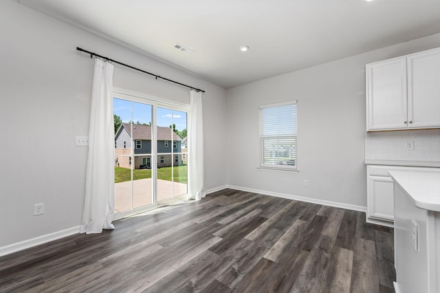 913 Fancher Ln, Joelton, TN 37080 - unfurnished dining area featuring plenty of natural light, dark wood-type flooring, baseboards, and recessed lighting