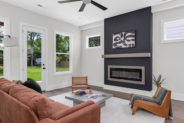 1816B Ashton Ave, Nashville, TN 37218 - living area with wood finished floors, a ceiling fan, a glass covered fireplace, and baseboards