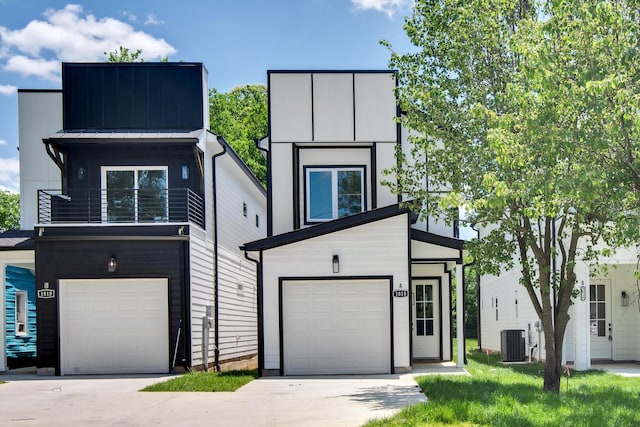 1816B Ashton Ave, Nashville, TN 37218 - contemporary house featuring a balcony, central AC unit, an attached garage, and a standing seam roof
