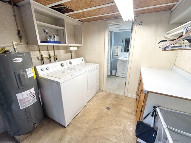 72 Allen Ln, Huntingdon, TN 38344 - laundry room with electric water heater, cabinet space, and washer and dryer