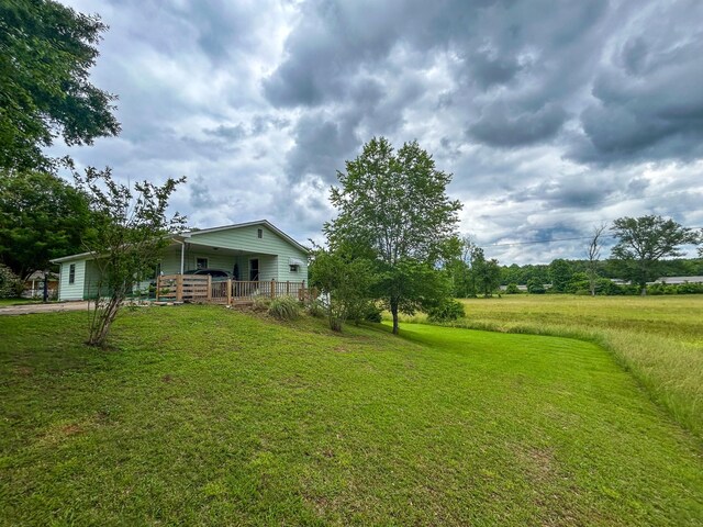 72 Allen Ln, Huntingdon, TN 38344 - view of grassy yard featuring a porch