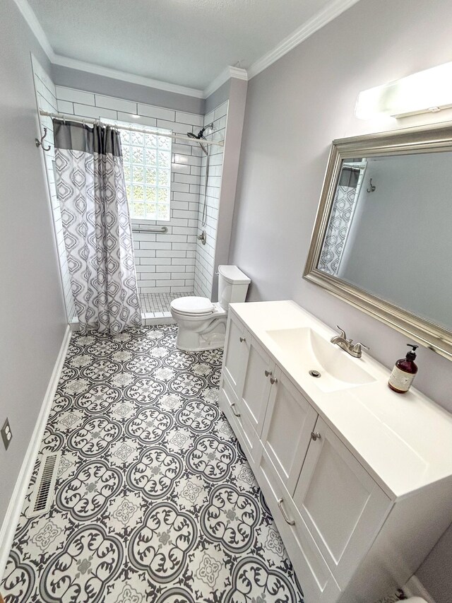 72 Allen Ln, Huntingdon, TN 38344 - bathroom with toilet, crown molding, vanity, a tile shower, and baseboards