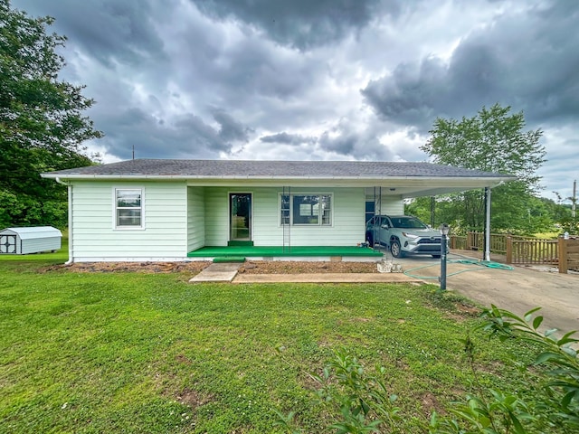72 Allen Ln, Huntingdon, TN 38344 - view of front of home with a carport, concrete driveway, and covered porch