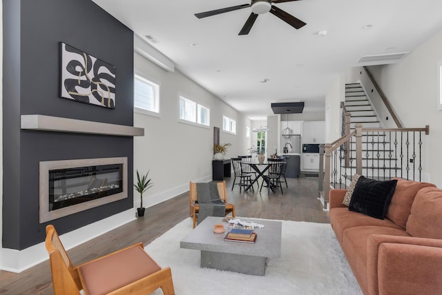 1816A Ashton Ave, Nashville, TN 37218 - living area with a ceiling fan, stairs, a glass covered fireplace, and wood finished floors