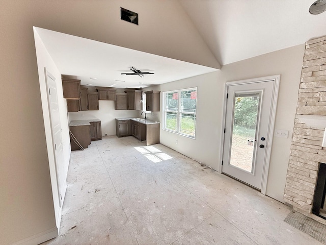 209 Griffey Ests, Clarksville, TN 37042 - kitchen featuring dark brown cabinetry and a fireplace