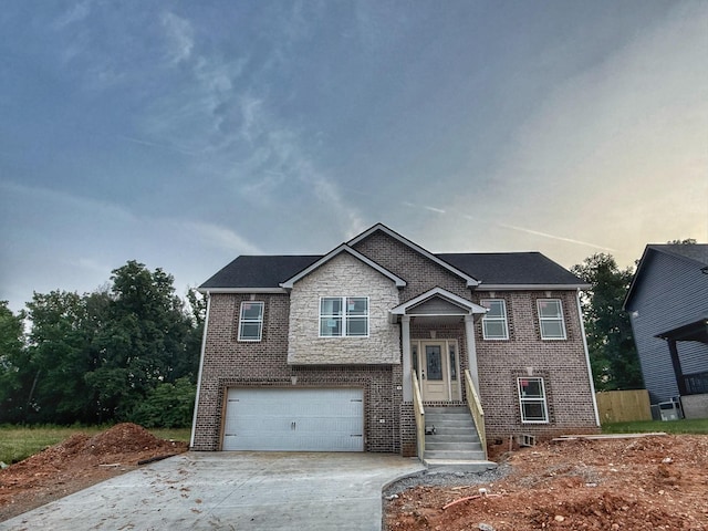 209 Griffey Ests, Clarksville, TN 37042 - bi-level home with driveway, brick siding, and an attached garage