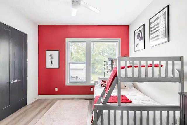 1144 Harmony Way, Nashville, TN 37207 - bedroom featuring wood finished floors, baseboards, an accent wall, and a ceiling fan