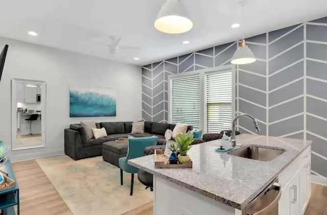 1144 Harmony Way, Nashville, TN 37207 - kitchen with a sink, dishwasher, white cabinets, light wood-style floors, and recessed lighting