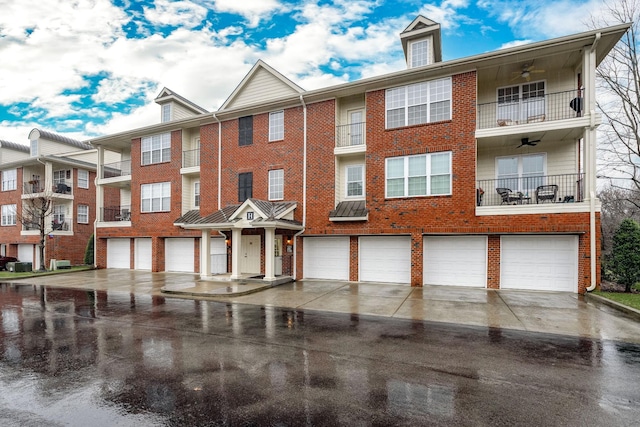 3201 Aspen Grove Dr Unit H8, Franklin, TN 37067 - view of building exterior featuring an attached garage and concrete driveway