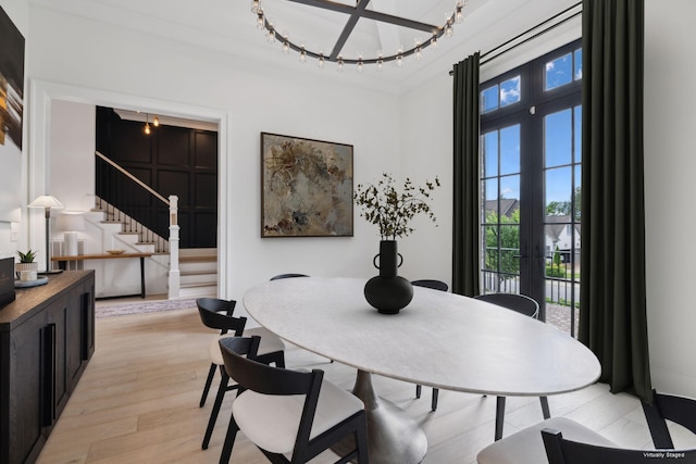 1518 Amesbury Ln, Franklin, TN 37069 - dining area with french doors, light wood finished floors, stairway, and a chandelier