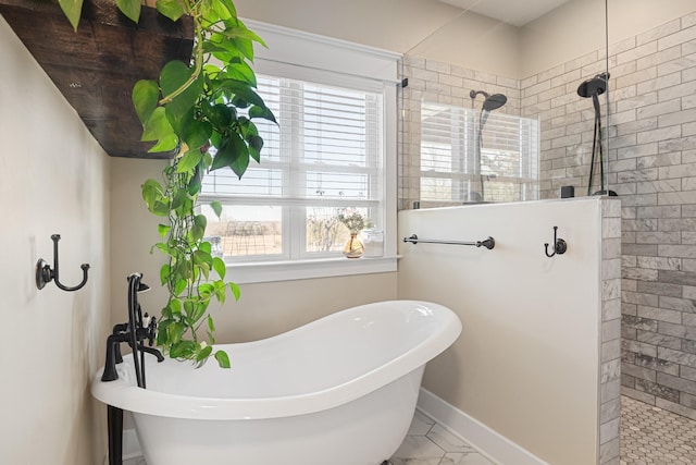 2824 Robert Truelove Rd, Columbia, TN 38401 - full bathroom featuring a walk in shower, a freestanding bath, marble finish floors, and baseboards
