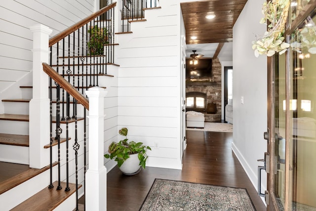 2824 Robert Truelove Rd, Columbia, TN 38401 - stairway with wood finished floors, ceiling fan, wood ceiling, a fireplace, and wood walls