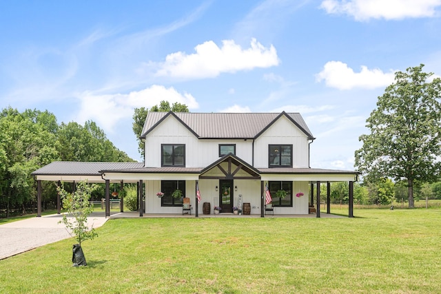 2824 Robert Truelove Rd, Columbia, TN 38401 - modern farmhouse style home featuring a porch, driveway, an attached carport, a front lawn, and metal roof