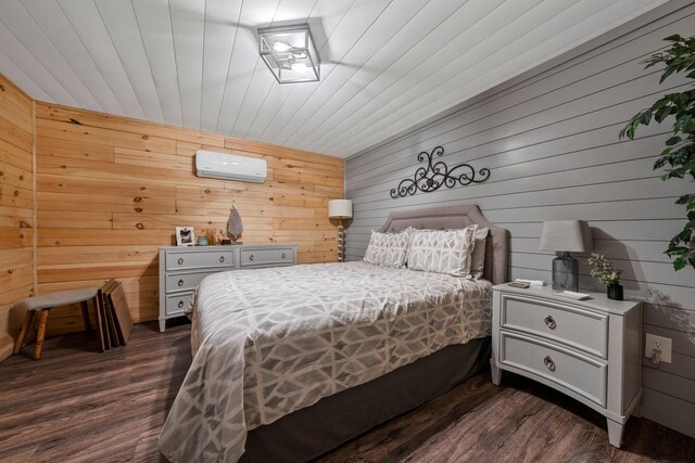 266 Campground Rd, Olmstead, KY 42265 - bedroom featuring a wall unit AC, wood walls, and dark wood-style floors