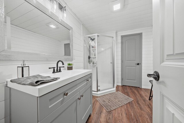 266 Campground Rd, Olmstead, KY 42265 - bathroom featuring vanity, a stall shower, wood finished floors, and wooden walls