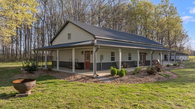 266 Campground Rd, Olmstead, KY 42265 - view of property exterior featuring a yard, metal roof, and a patio
