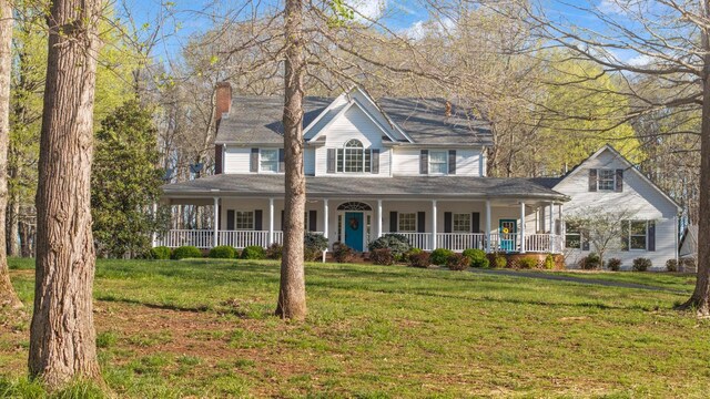 266 Campground Rd, Olmstead, KY 42265 - view of front facade with covered porch, a chimney, and a front yard