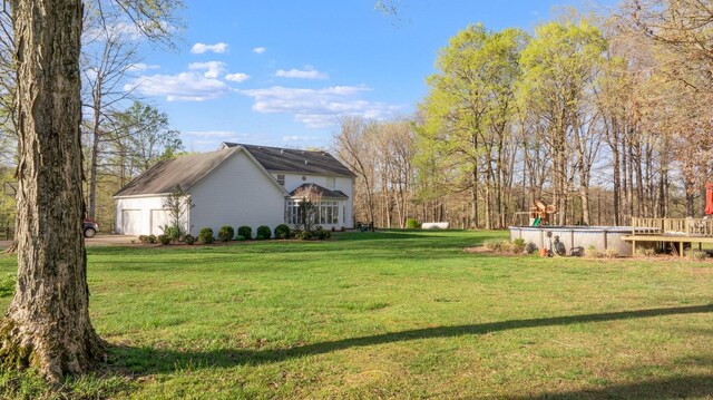 266 Campground Rd, Olmstead, KY 42265 - view of grassy yard featuring an outdoor pool, a garage, and driveway