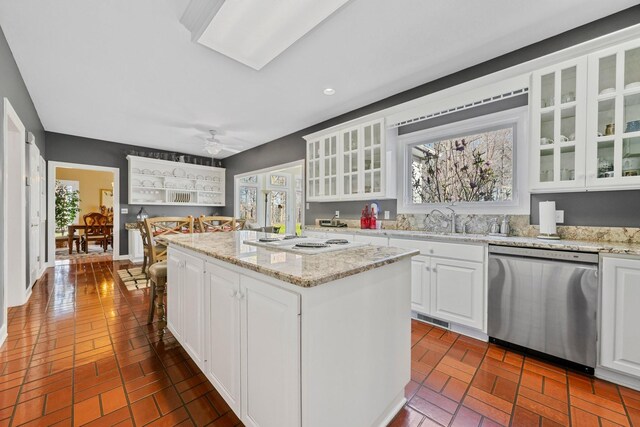 266 Campground Rd, Olmstead, KY 42265 - kitchen with dishwasher, brick floors, a kitchen island, white electric cooktop, and ceiling fan