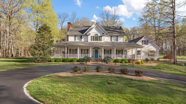 266 Campground Rd, Olmstead, KY 42265 - view of front facade featuring driveway, a porch, a chimney, and a front yard