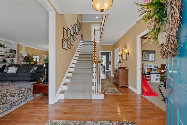 266 Campground Rd, Olmstead, KY 42265 - foyer entrance with wood finished floors, ornamental molding, stairs, and baseboards