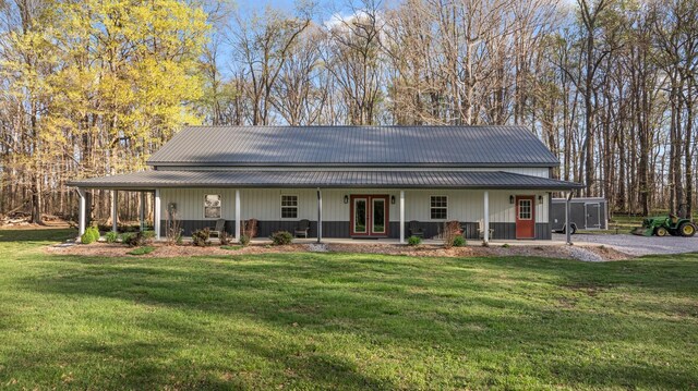266 Campground Rd, Olmstead, KY 42265 - farmhouse inspired home featuring covered porch, a front lawn, and metal roof