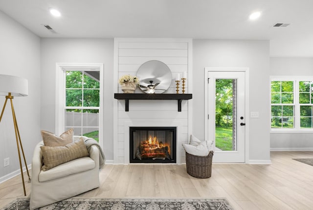 264 Kildeer Dr, Clarksville, TN 37040 - living area with a large fireplace, wood finished floors, baseboards, and recessed lighting