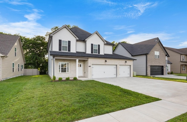 264 Kildeer Dr, Clarksville, TN 37040 - view of front facade with concrete driveway, an attached garage, brick siding, and roof with shingles