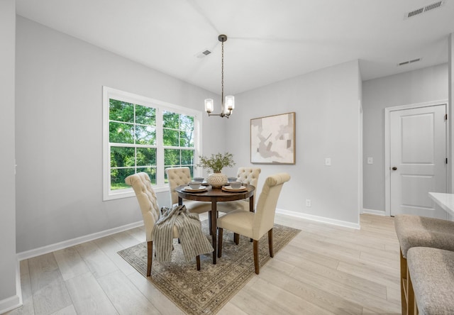 264 Kildeer Dr, Clarksville, TN 37040 - dining space featuring a chandelier, light wood-type flooring, and baseboards
