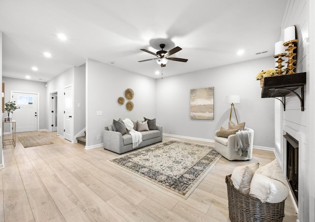 264 Kildeer Dr, Clarksville, TN 37040 - living area with recessed lighting, stairway, a ceiling fan, light wood-style flooring, and a fireplace
