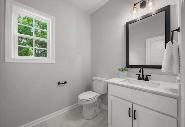 264 Kildeer Dr, Clarksville, TN 37040 - bathroom with baseboards, vanity, toilet, and marble look tile flooring