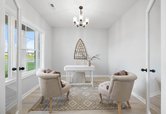 264 Kildeer Dr, Clarksville, TN 37040 - sitting room featuring french doors, a chandelier, baseboards, and wood finished floors