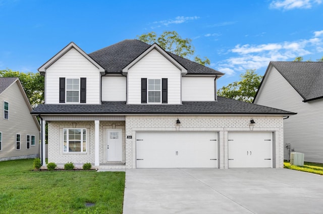 264 Kildeer Dr, Clarksville, TN 37040 - traditional-style home featuring concrete driveway, a front yard, a shingled roof, and brick siding