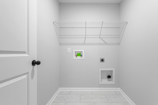 264 Kildeer Dr, Clarksville, TN 37040 - laundry room featuring hookup for an electric dryer, light marble finish floors, washer hookup, and baseboards