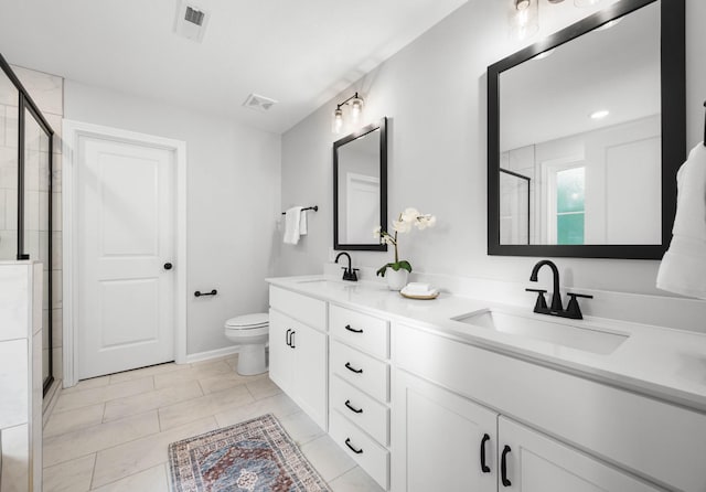 264 Kildeer Dr, Clarksville, TN 37040 - bathroom featuring double vanity, tiled shower, toilet, and baseboards