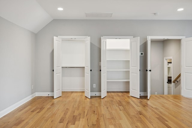 1712 Sorrell Park Dr, Spring Hill, TN 37174 - unfurnished bedroom with light wood-style flooring, multiple closets, baseboards, recessed lighting, and vaulted ceiling