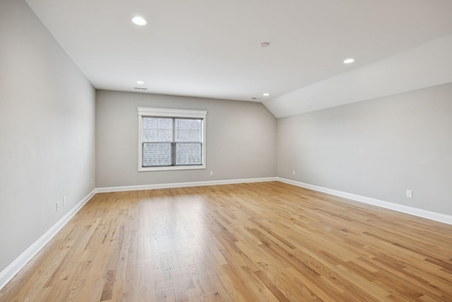 1712 Sorrell Park Dr, Spring Hill, TN 37174 - spare room featuring recessed lighting, light wood-type flooring, vaulted ceiling, and baseboards