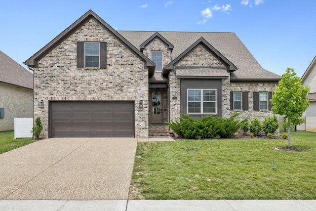 1712 Sorrell Park Dr, Spring Hill, TN 37174 - view of front of home with concrete driveway, a front lawn, brick siding, and an attached garage