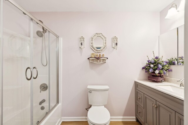 1540 Centerville Hwy, Hohenwald, TN 38462 - full bath with vanity, toilet, combined bath / shower with glass door, and baseboards