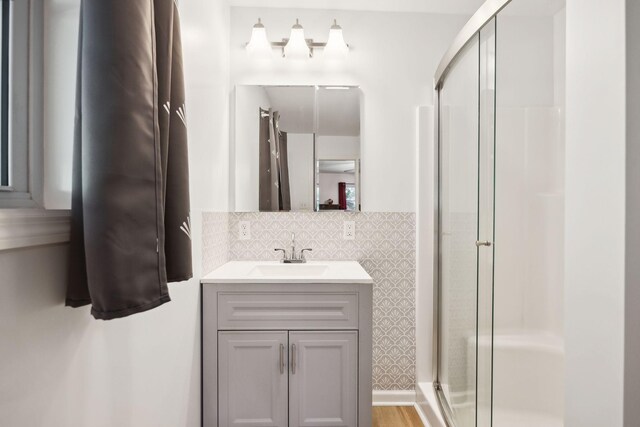 1540 Centerville Hwy, Hohenwald, TN 38462 - bathroom featuring a stall shower, vanity, and decorative backsplash