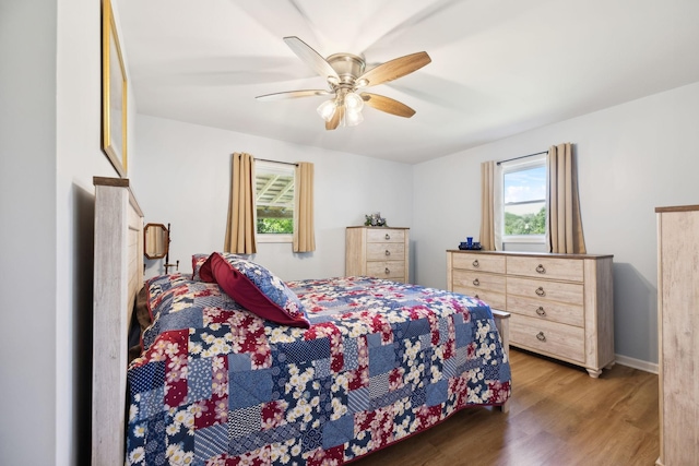 1540 Centerville Hwy, Hohenwald, TN 38462 - bedroom with wood finished floors, ceiling fan, and baseboards