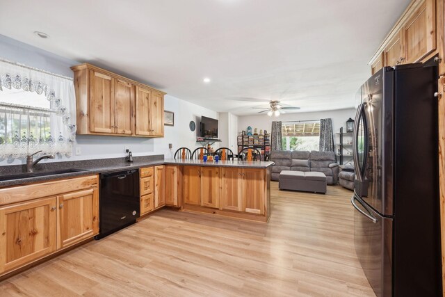 1540 Centerville Hwy, Hohenwald, TN 38462 - kitchen featuring freestanding refrigerator, black dishwasher, a peninsula, open floor plan, and ceiling fan