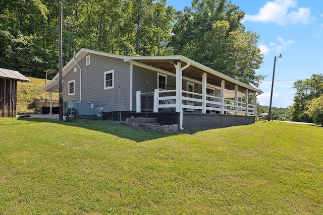1540 Centerville Hwy, Hohenwald, TN 38462 - view of home's exterior featuring a lawn and a porch