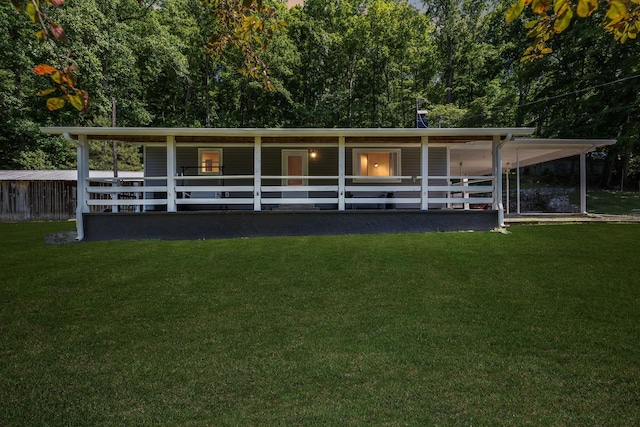 1540 Centerville Hwy, Hohenwald, TN 38462 - rear view of house with an attached carport and an exterior structure