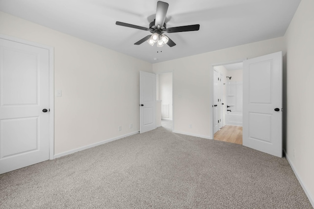 174 Oak St, Clarksville, TN 37042 - unfurnished bedroom with light colored carpet, baseboards, ensuite bathroom, and ceiling fan